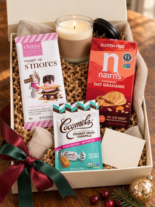 Fireside S'mores gift box — soy wax candle in a clear glass tumbler with a black metal lid, Chuao Chocolatier Snuggle Up S'mores Chocolate Bar, Nairn's Gluten Free Oat Grahams, Original, Cocomels Coconut Cream Caramels, Sea Salt