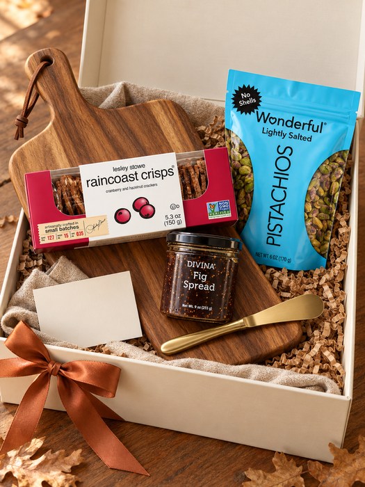 Gathering Board gift box — acacia serving board with gold cheese spreader, Lesley Stowe Raincoast Crisps Cranberry & Hazelnut, Divina Fig Spread, Wonderful Pistachios Lightly Salted Pistachios, No Shells